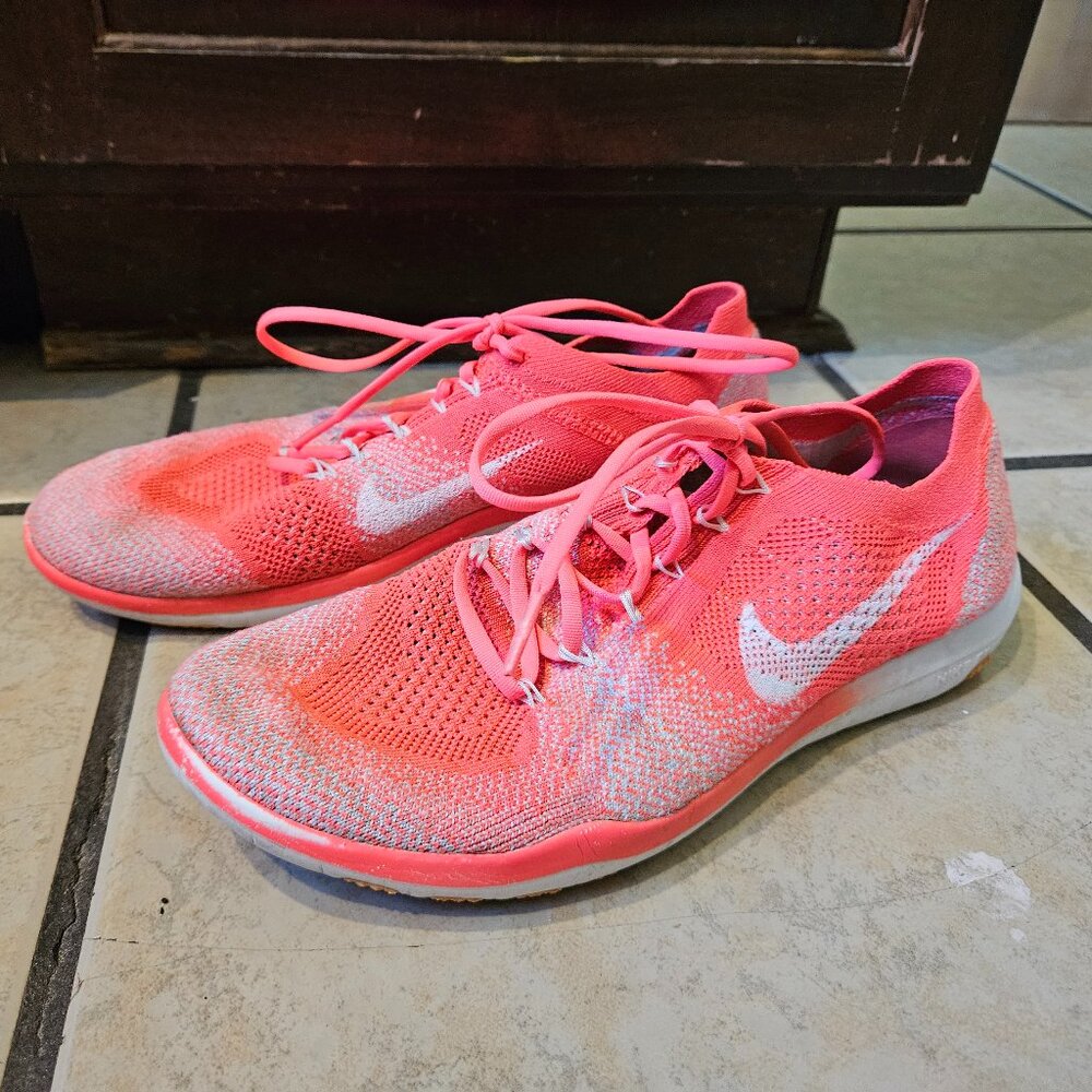 Bright pink Nike women's lightweight running/athletic shoes